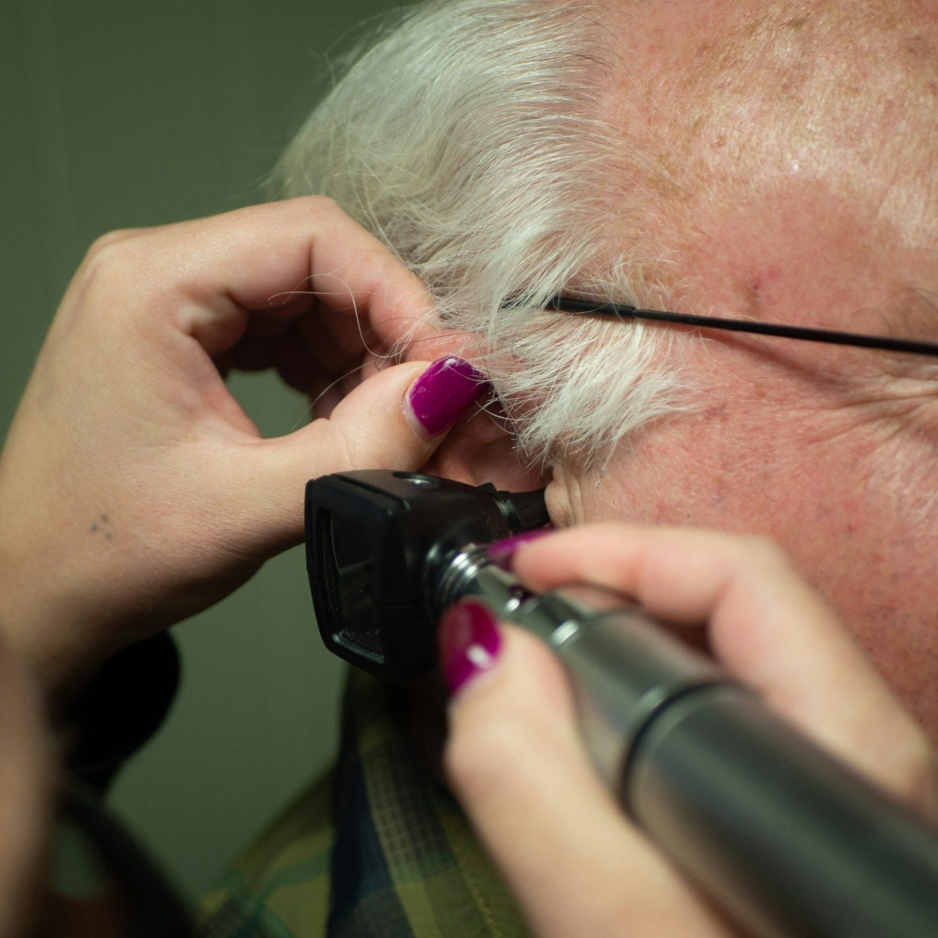 Ear Wax being check with Otoscope